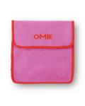 foldable lunch bag with pockets and strap by OMIE in pink color holds the OMIE Box, OMIE Box Up, OMIE dip & Omie Pod, water bottle and cutlery!